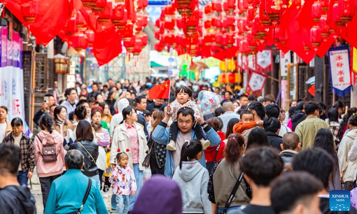 People visit a historical and cultural street in Xixiu District of Anshun City, southwest China's Guizhou Province, Oct. 2, 2024. The National Day holiday period, which runs from Oct. 1 to Oct. 7 this year, is a peak travel and tourism season in China.  (Photo: Xinhua)