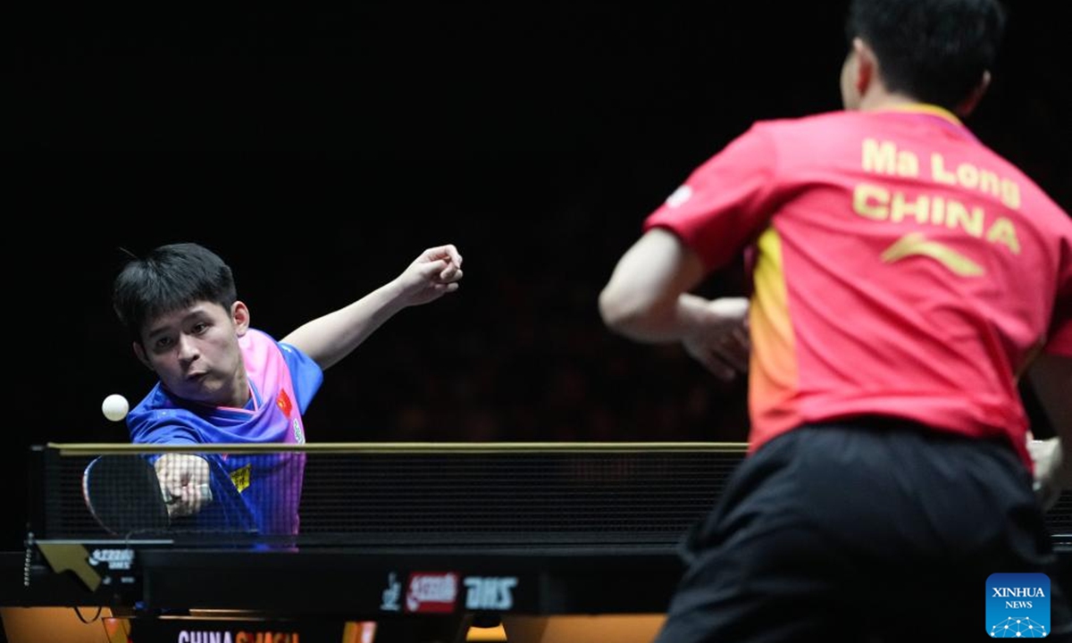 Lin Shidong (L) of China hits a return during the men's singles final match against Ma Long of China at 2024 World Table Tennis (WTT) China Smash in Beijing, China, Oct. 6, 2024. (Photo: Xinhua)