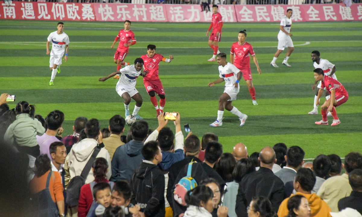 Spectators watch a soccer match in Rongjiang county, Southwest China's Guizhou Province on October 3, 2024. Photo: VCG