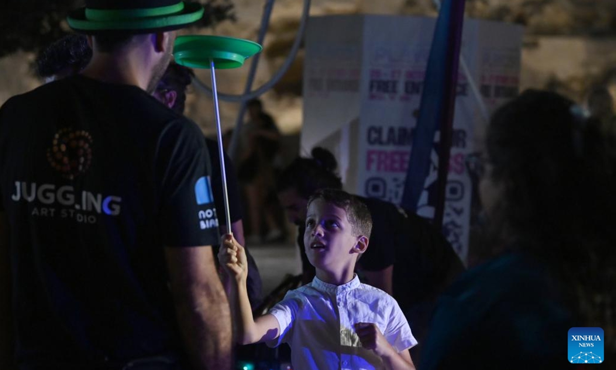 A boy plays during the Notte Bianca festival in Valletta, Malta, on Oct. 5, 2024. (Photo: Xinhua)