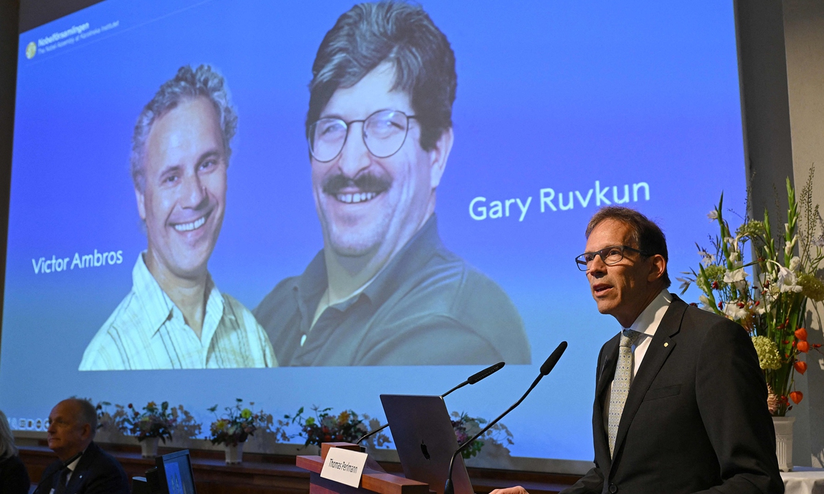 Nobel Committee Secretary General Thomas Perlmann speaks to the media in front of a picture of this year's laureates Victor Ambros and Gary Ruvkun during the announcement of the winners of the 2024 Nobel Prize in Physiology or Medicine at the Karolinska Institute in Stockholm on October 7, 2024. Ambros and Ruvkun won the prize for the discovery of microRNA and its role in how gene activity is regulated, the Nobel jury said. Photo: VCG