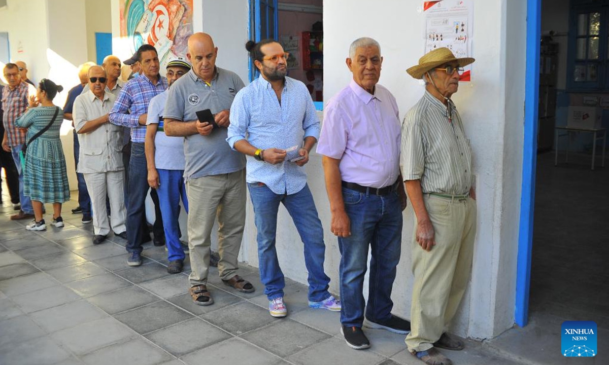 Tunisian voters line up to vote outside a polling center in Tunis, Tunisia on Oct. 6, 2024. The polling centers for the Tunisian presidential elections opened on Sunday in 24 provinces of Tunisia, Tunisia's Independent High Authority for Elections said.  (Photo: Xinhua)