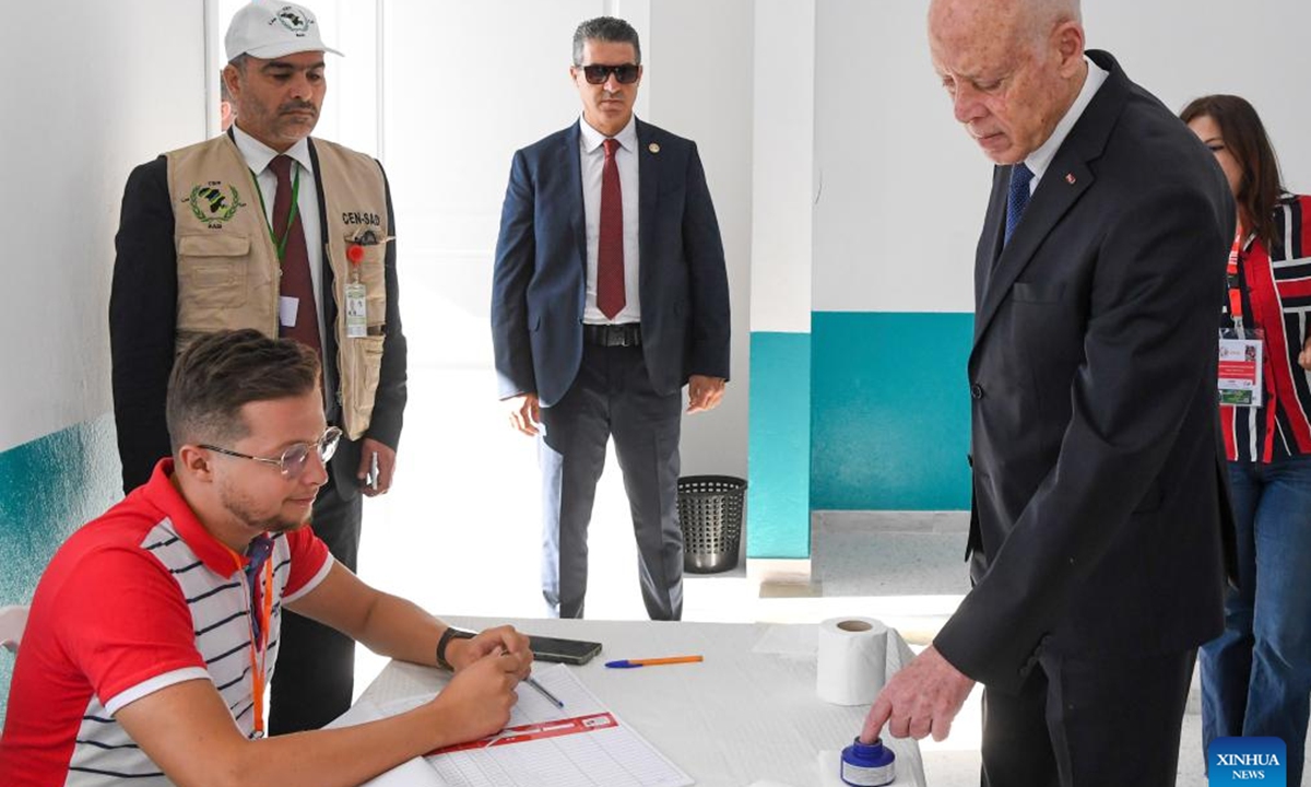 Tunisian President Kais Saied (R, front) registers at a polling center in Tunis, Tunisia on Oct. 6, 2024. The polling centers for the Tunisian presidential elections opened on Sunday in 24 provinces of Tunisia, Tunisia's Independent High Authority for Elections said. (Photo: Xinhua)