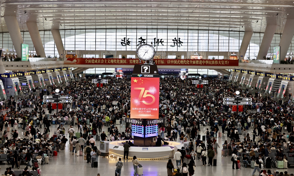 Passengers wait for trains at Hangzhou East Railway Station in Hangzhou, East China's Zhejiang Province on October 7, 2024, the last day of China's weeklong National Day holidays, also known as the 