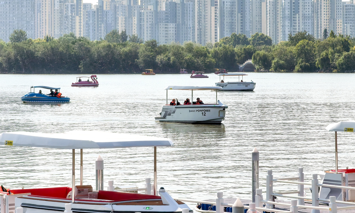 Tourists experience smart sightseeing boats at Tianjin Water Park on October 7, 2024. The first fleet of 15 smart boats has been put into use at the park, equipped with the BeiDou Navigation Satellite System, 5G networking, intelligent driving and other cutting-edge technologies. Photo: VCG