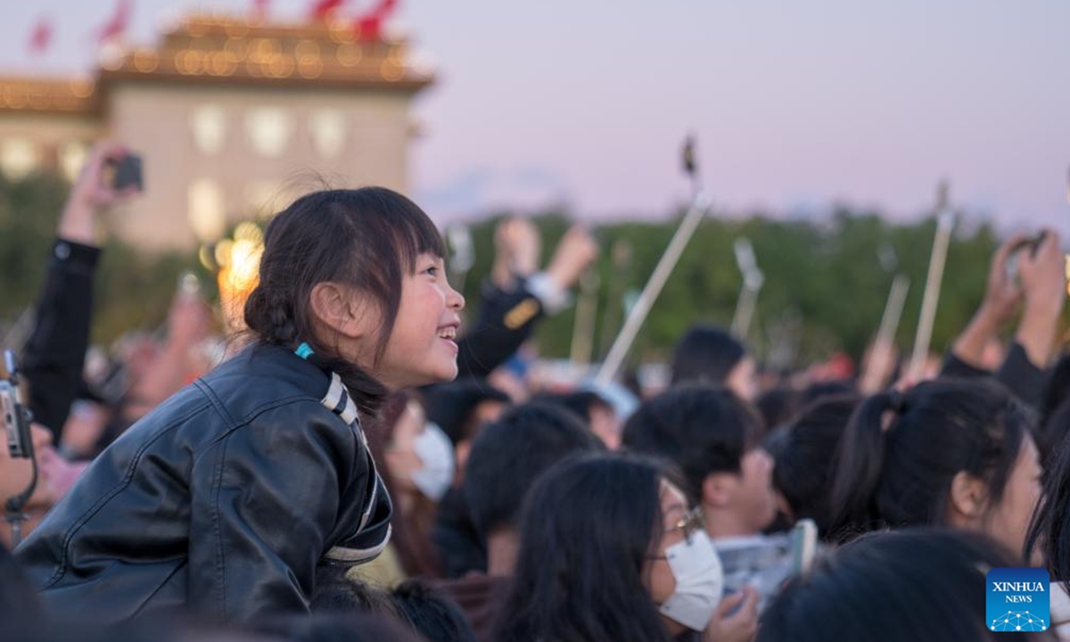 People wait to watch the flag-raising ceremony at Tian'anmen Square in Beijing, capital of China, Oct. 1, 2024. The National Day holiday period, which runs from Oct. 1 to Oct. 7 this year, is a peak travel and tourism season in China.  (Photo: Xinhua)