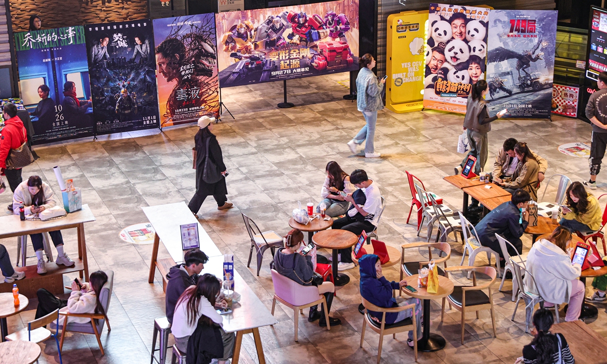 Moviegoers wait in a movie theater in Shenyang, Liaoning Province, on October 7, 2024. Photo: VCG