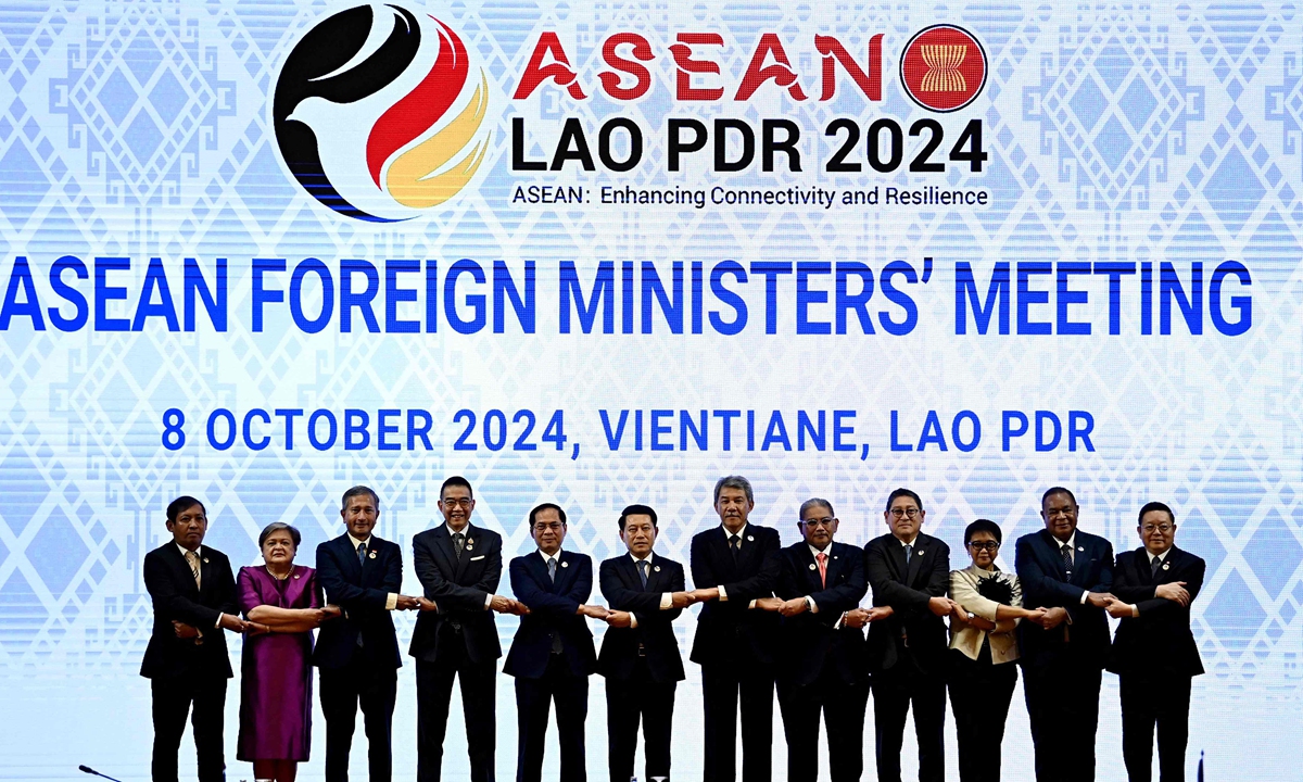 Foreign ministers of 10 ASEAN members and East Timor, observer of the organization, as well as ASEAN Secretary General Kao Kim Hourn pose for a family photo during the 57th ASEAN Foreign Ministers Plenary Meeting session in Vientiane, Laos on October 8, 2024. Photo: VCG