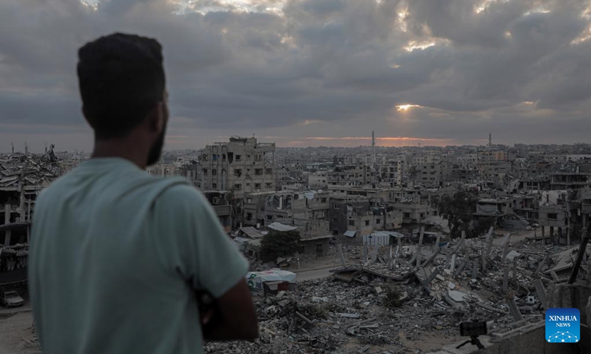 A man watches the sun rising at the southern Gaza Strip city of Khan Younis on Oct. 7, 2024. (Photo: Xinhua)