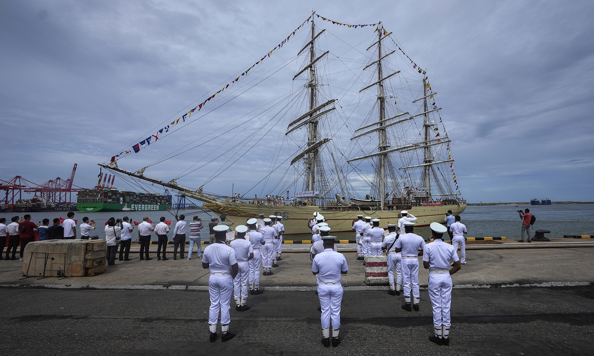 

Sri Lankan navy sailors and Chinese nationals in Sri Lanka welcome the Chinese navy's first sailing training ship <em>Po Lang</em> as it docks in Colombo, Sri Lanka, on October 8, 2024. The ship is on a three-day visit to Sri Lanka, during which the Chinese side will engage in professional exchanges at Sri Lanka's General Sir John Kotelawala Defence University, hold discussions and sports competitions with Sri Lanka's navy, and organize ship open days and deck receptions. Photo: VCG