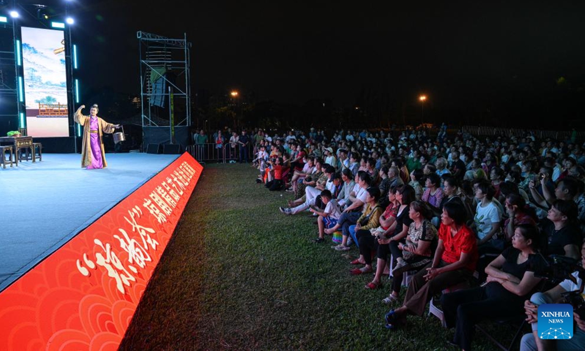 People watch Qiong Opera performance at the Evergreen Park in Haikou, south China's Hainan Province, Oct. 6, 2024. As one of the series activities of the first edition of the Haikou Urban Art Week, a Qiong Opera performance was held here on Sunday.

Qiong Opera could be traced back to a century ago in Ding'an County in this southern Chinese island, which is referred to as Qiong in abbreviation. (Photo: Xinhua)