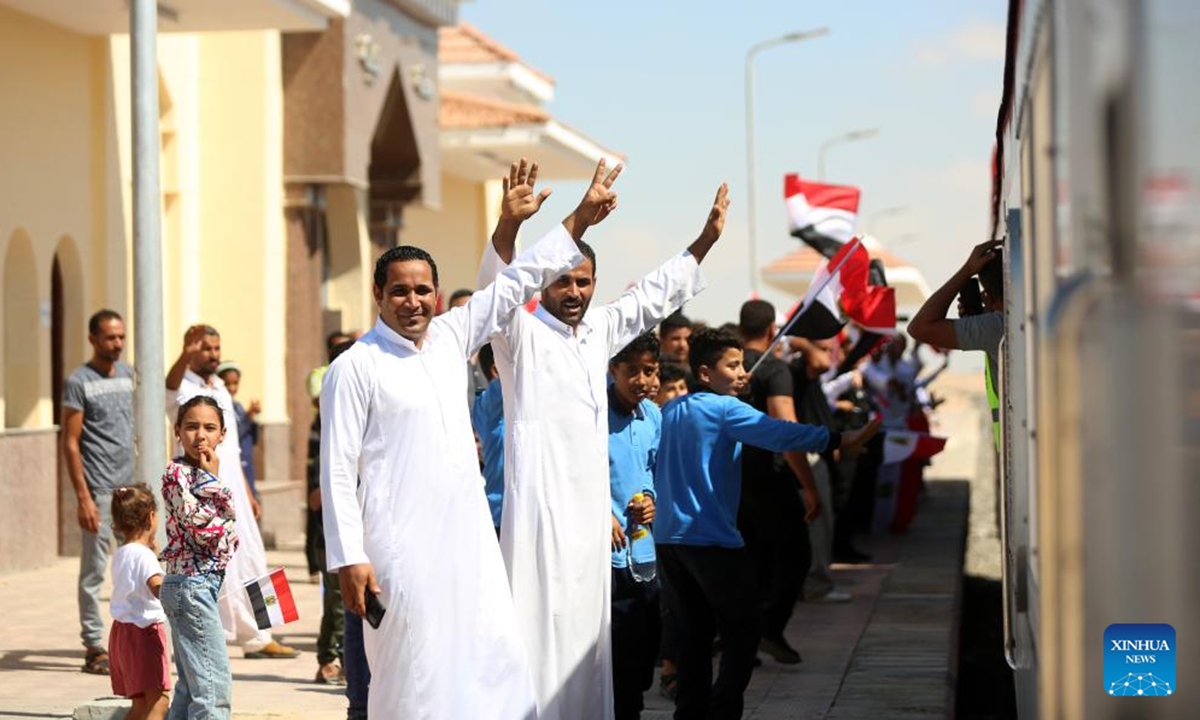 People celebrate the trial operation of a railway in North Sinai, Egypt, on Oct. 7, 2024. A 100-kilometer railway in North Sinai began trial operations on Monday, restoring train service to the region for the first time in more than half a century. (Photo: Xinhua)