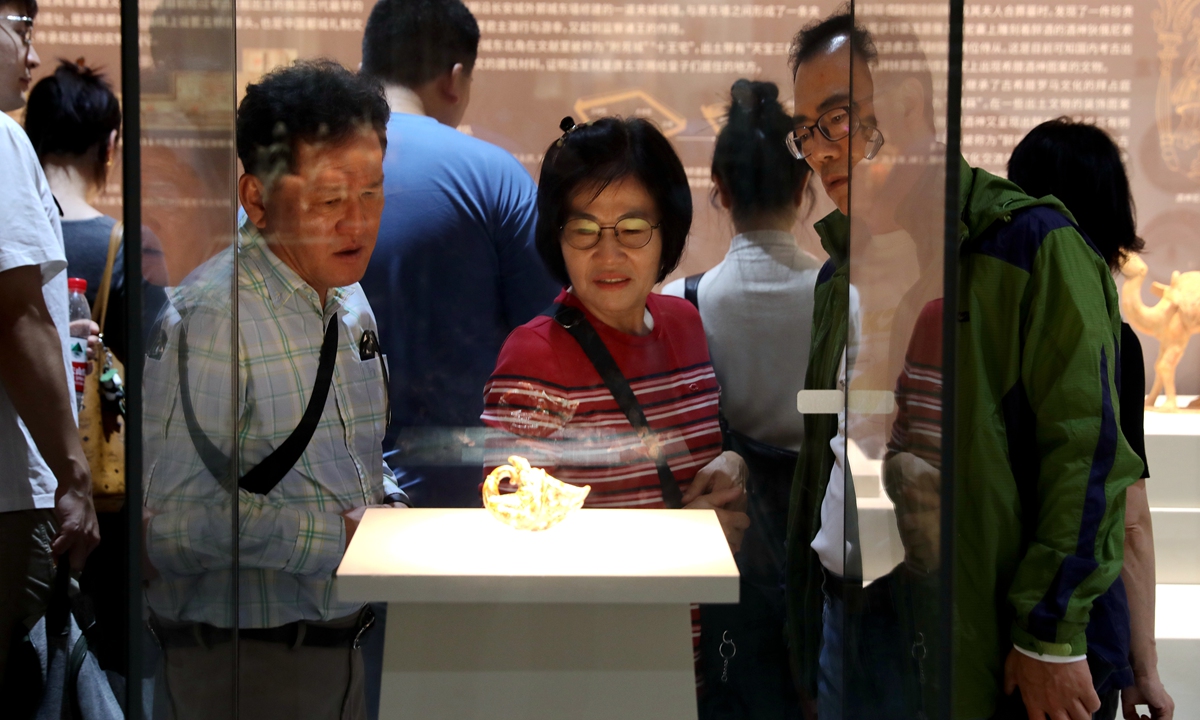 Visitors attend an exhibition showcasing 30 years of archaeological achievements in Xi'an, Northwest China's Shaanxi Province, on October 9, 2024. The exhibition features over 280 exquisite cultural relics from more than 30 archaeological sites in Xi'an, making it the largest temporary exhibition at the Xi'an Museum in terms of the number of artifacts displayed, most of which are being exhibited for the first time. Photo: VCG