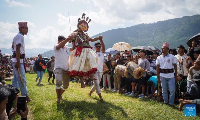 A masked dancer performs during the festival of Rudrayani, widely known as Sikali Jatra, in Khokana village of Lalitpur, Nepal, Oct. 8, 2024. (Photo: Xinhua)