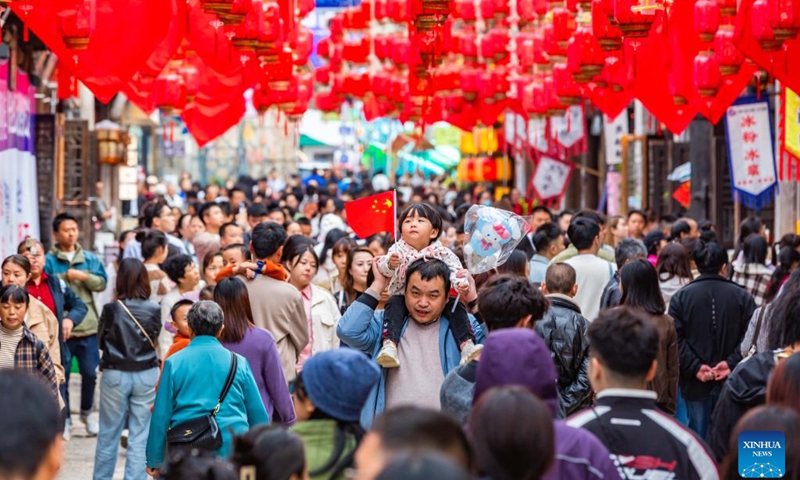 People visit a historical and cultural street in Xixiu District of Anshun City, southwest China's Guizhou Province, Oct. 2, 2024. China recorded 765 million domestic tourist trips during the 7-day National Day holiday that ended Monday, representing a year-on-year increase of 5.9 percent on a comparable basis, according to data from the Ministry of Culture and Tourism. (Photo: Xinhua)