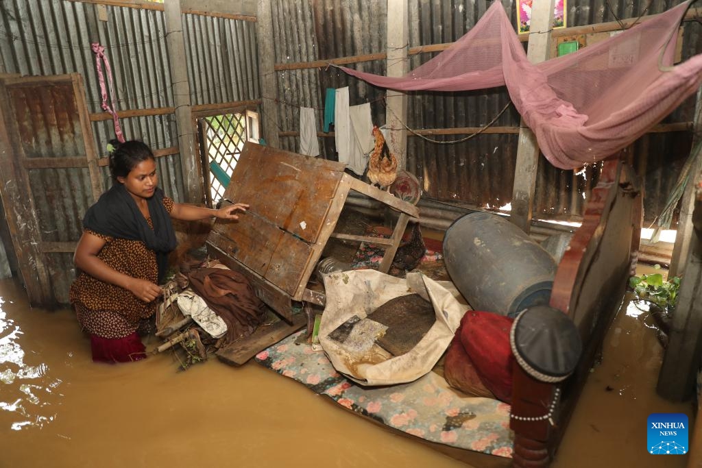 This photo shows an interior view of a flooded house in Mymensingh, Bangladesh, Oct. 7, 2024. Days of devastating flash floods, triggered by heavy rains and upstream torrents, have stranded hundreds of thousands of people in Bangladesh's northern Mymensingh region, with thousands of homes still under water. (Photo: Xinhua)