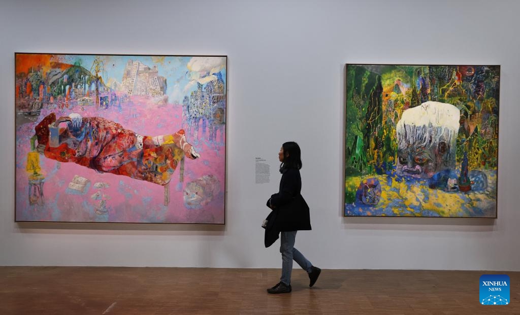 A woman visits the exhibition China: A new generation of artists during a press tour at the Centre Pompidou in Paris, France, Oct. 8, 2024. The exhibition, featuring works by Chinese artists born between the late 1970s and the early 1990s, opens to the public from Oct. 9, 2024 to Feb. 3, 2025 (Photo: Xinhua)