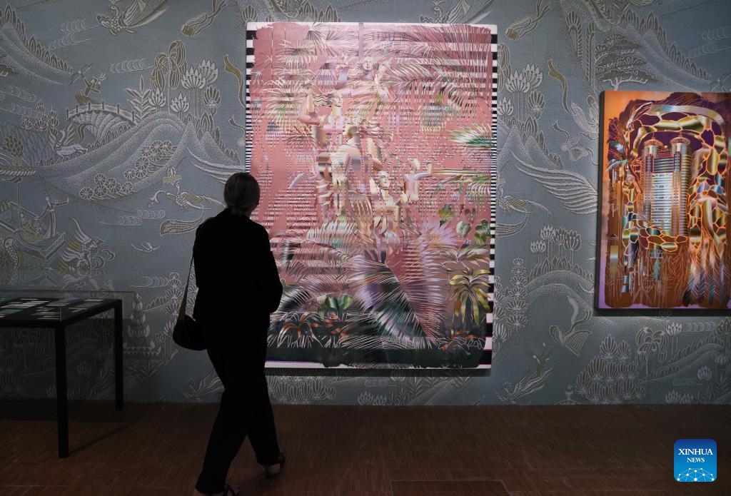 A woman visits the exhibition China: A new generation of artists during a press tour at the Centre Pompidou in Paris, France, Oct. 8, 2024. The exhibition, featuring works by Chinese artists born between the late 1970s and the early 1990s, opens to the public from Oct. 9, 2024 to Feb. 3, 2025 (Photo: Xinhua)