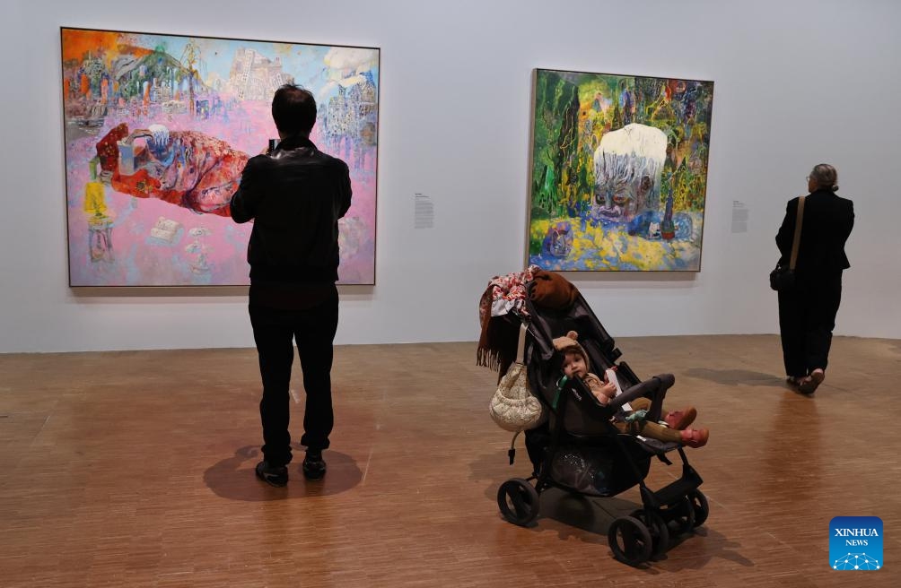 People visit the exhibition China: A new generation of artists during a press tour at the Centre Pompidou in Paris, France, Oct. 8, 2024. The exhibition, featuring works by Chinese artists born between the late 1970s and the early 1990s, opens to the public from Oct. 9, 2024 to Feb. 3, 2025 (Photo: Xinhua)