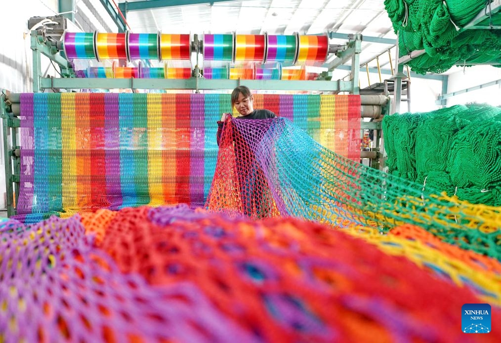 A woman works at a workshop of a sports equipment company in Huimin County, east China's Shandong Province, Oct. 8, 2024. Huimin County boasts a three-century history in rope and net production, and is now home to hundreds of enterprises making such products. The county holds a lion's share in the national market for ropes and nets, which are widely used in construction, sports and other sectors. (Photo: Xinhua)