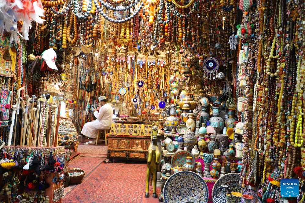 Products are displayed at a shop in the Mutrah Souq market in Muscat, Oman, Oct. 8, 2024. Mutrah Souq, located along the waterfront of Muscat, is a traditional Arab market. Shops here offer artifacts, antiques, textiles and jewelry, making the market one of the most well known tourist attractions in Muscat. (Photo: Xinhua)