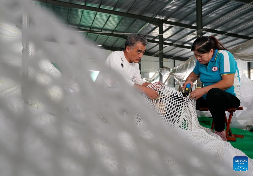 People work at a workshop of a sports equipment company in Huimin County, east China's Shandong Province, Oct. 8, 2024. Huimin County boasts a three-century history in rope and net production, and is now home to hundreds of enterprises making such products. The county holds a lion's share in the national market for ropes and nets, which are widely used in construction, sports and other sectors. (Photo: Xinhua)