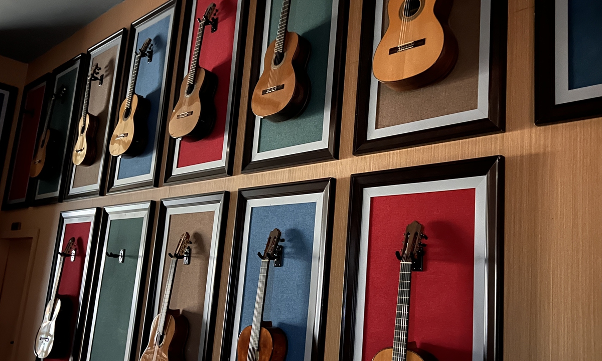 Handmade guitars with Chinese cultural characteristics are displayed on the wall of guitar production master Zhang Weiyi's studio in Zheng'an guitar industrial park on October 4, 2024. Photo: Leng Shumei/Global Times