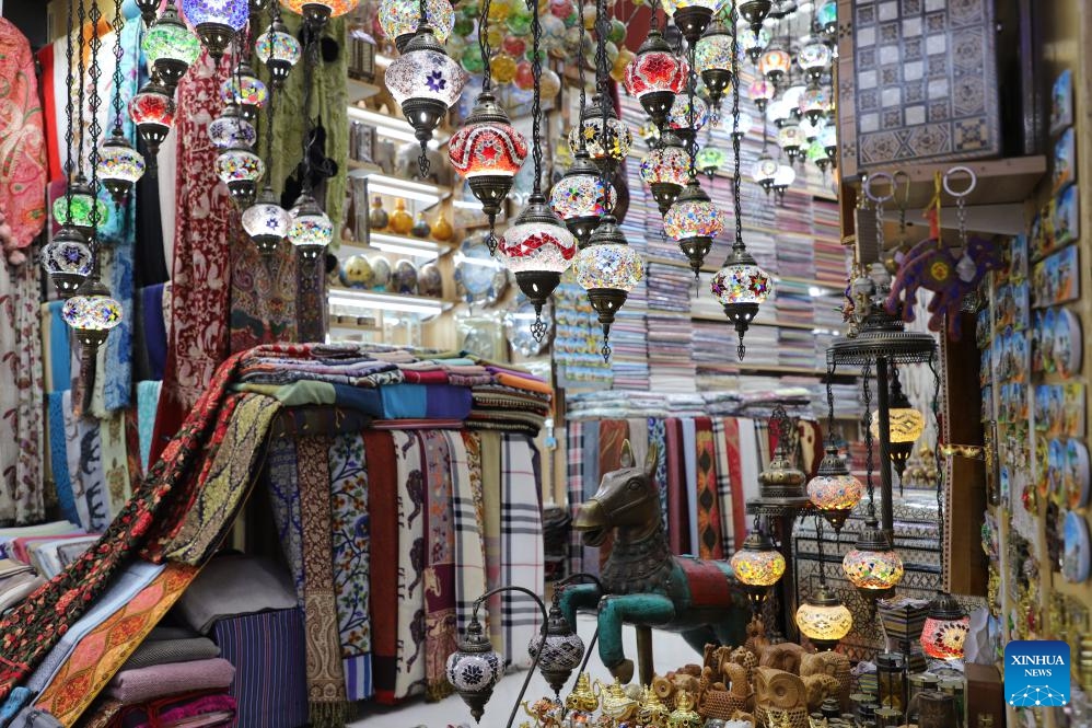 Products are displayed at a shop in the Mutrah Souq market in Muscat, Oman, Oct. 8, 2024. Mutrah Souq, located along the waterfront of Muscat, is a traditional Arab market. Shops here offer artifacts, antiques, textiles and jewelry, making the market one of the most well known tourist attractions in Muscat. (Photo: Xinhua)