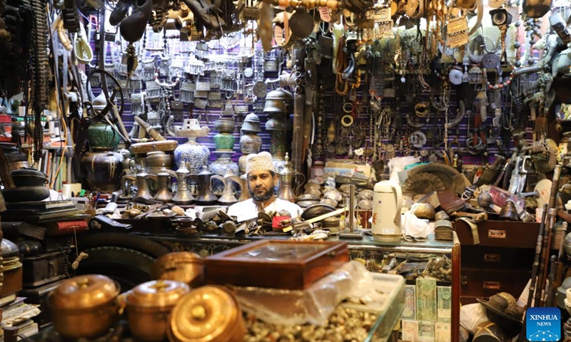 Products are displayed at a shop in the Mutrah Souq market in Muscat, Oman, Oct. 8, 2024. Mutrah Souq, located along the waterfront of Muscat, is a traditional Arab market. Shops here offer artifacts, antiques, textiles and jewelry, making the market one of the most well known tourist attractions in Muscat. (Photo: Xinhua)