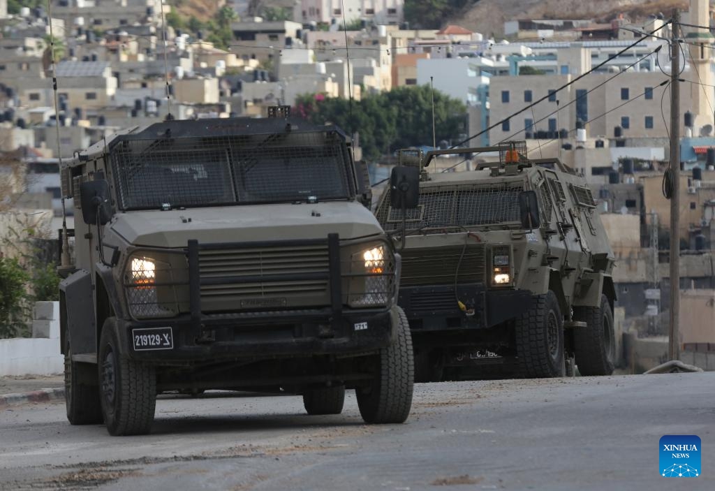 Vehicles of Israeli forces are seen on a street during an Israeli operation in Far'a refugee camp, south of the West Bank City of Tubas, on Oct. 10, 2024. (Photo: Xinhua)