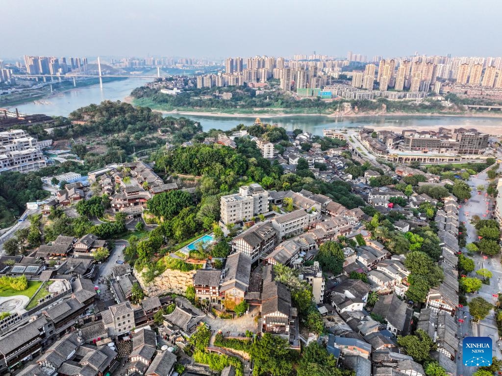 An aerial drone photo taken on Oct. 9, 2024 shows a view of the Ciqikou ancient town in southwest China's Chongqing Municipality. Located by the Jialing River in Chongqing, the ancient town of Ciqikou was first built in the Northern Song Dynasty (960-1127). In recent years, local authorities have advanced the integration of cultural and tourism development and the urban renewal, while preserving the authentic charm of the ancient town. (Photo: Xinhua)