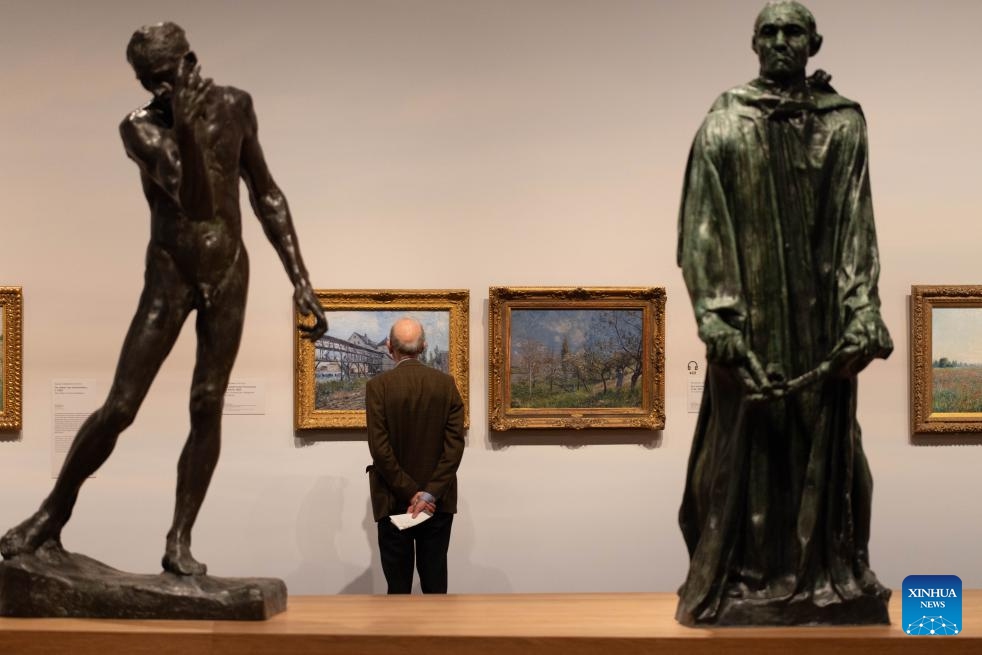 A man looks at an exhibit during the exhibition Long Live Impressionism! during the press preview at the Van Gogh Museum in Amsterdam, the Netherlands, Oct. 9, 2024. The exhibition is held to celebrate the 150th anniversary of Impressionism, featuring masterpieces by renowned Impressionists of the late 19th century. (Photo: Xinhua)