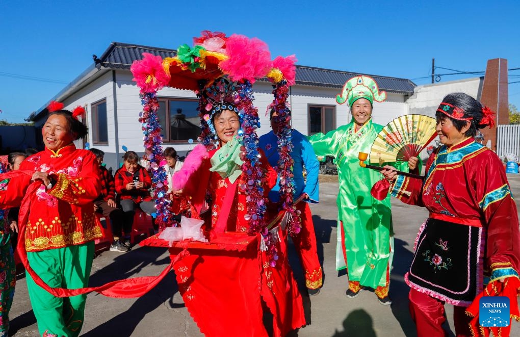 Volunteers perform folk dance for local seniors in Zunhua, north China's Hebei Province, Oct. 10, 2024. A series of celebration activities were held across the country to mark the country's Seniors' Day, which falls on Oct. 11 this year. (Photo: Xinhua)