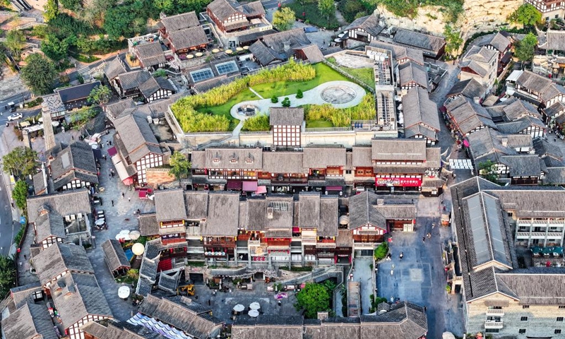 An aerial drone photo taken on Oct. 9, 2024 shows a view of the Ciqikou ancient town in southwest China's Chongqing Municipality. Located by the Jialing River in Chongqing, the ancient town of Ciqikou was first built in the Northern Song Dynasty (960-1127). In recent years, local authorities have advanced the integration of cultural and tourism development and the urban renewal, while preserving the authentic charm of the ancient town. (Photo: Xinhua)