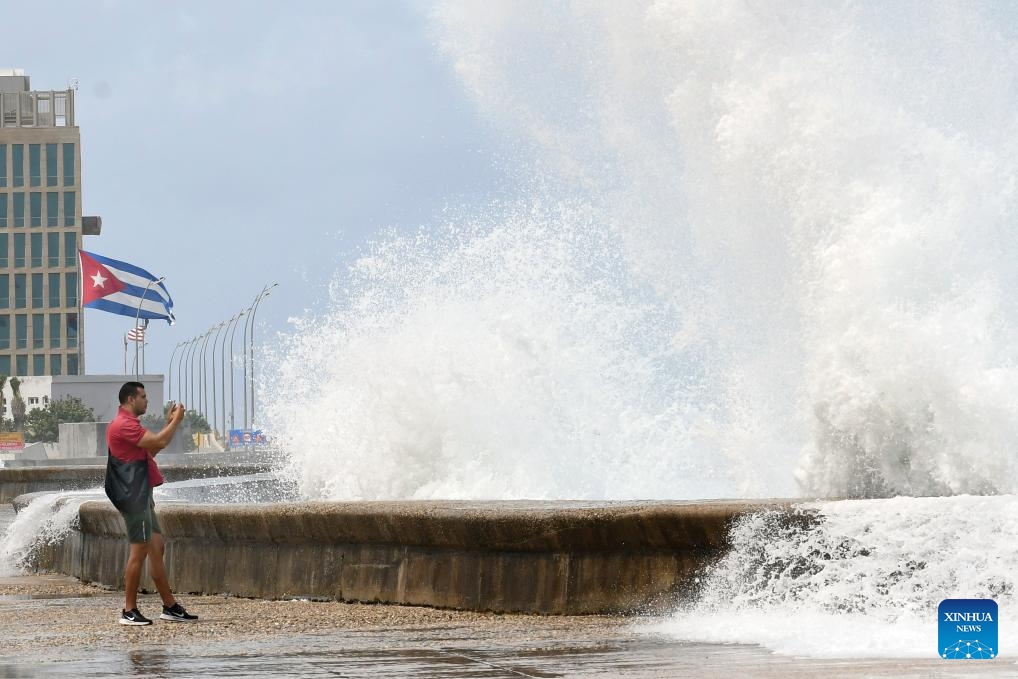 Huge waves are seen along a seaside road in Havana, Cuba, Oct. 9, 2024. Hurricane Milton brought intermittent rainfall to Cuba. (Photo: Xinhua)