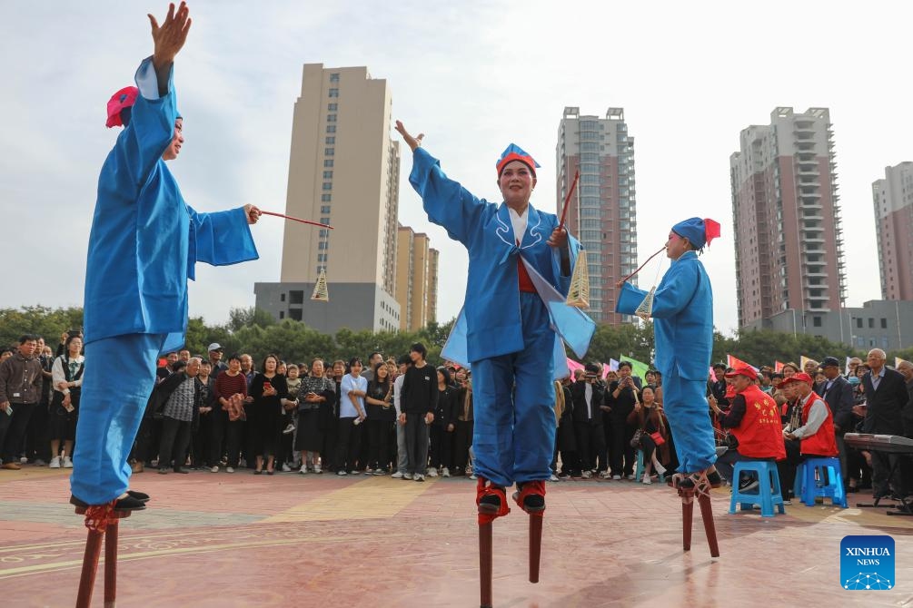 Folk aritists perform at a square in Baofeng County, central China's Henan Province, Oct. 10, 2024. A series of activities to promote Baofeng's intangible cultural heritages were held here on Thursday. (Photo: Xinhua)