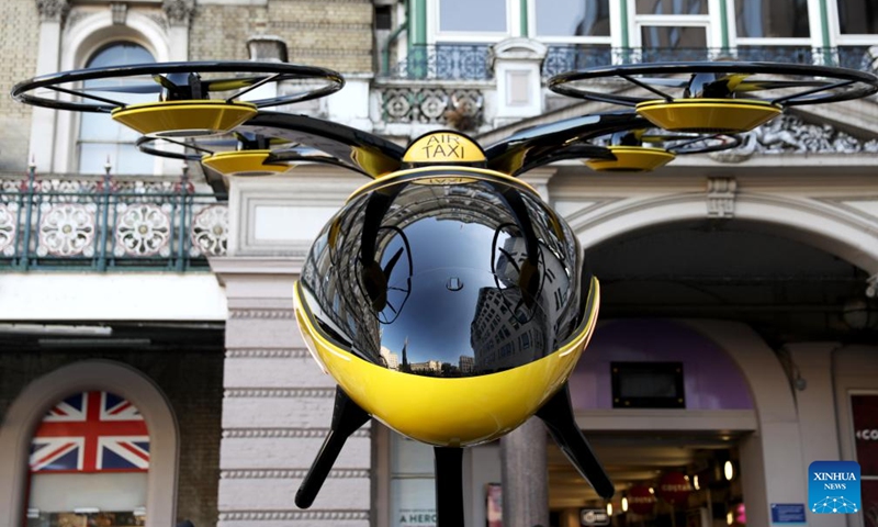 A prototype of a flying taxi, which is currently in development in the United Arab Emirates (UAE), is seen on display in the taxi rank outside Charing Cross railway station in London, Britain, Oct. 11, 2024. (Photo: Xinhua)