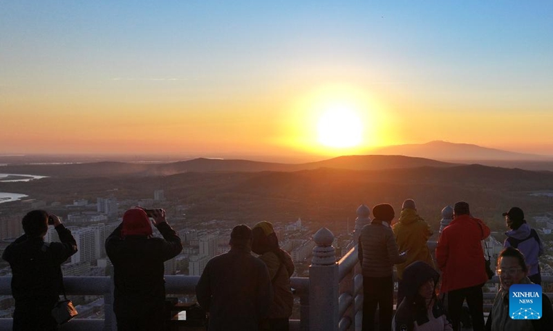 A drone photo shows tourists enjoying the sunrise scenery in Fuyuan City, northeast China's Heilongjiang Province, Oct. 12, 2024. Fuyuan City, a famous tourist attraction, has attracted over 2.1 million visitors from January to September this year. (Photo: Xinhua)