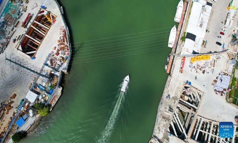 An aerial drone photo shows the construction site of the Sanya River estuary passage project in Sanya, south China's Hainan Province, Oct. 12, 2024. The Sanya River estuary passage project undertaken by China Railway 20th Bureau Group is making steady progress. As the first underwater tunnel in Sanya, the project will further optimize the urban spatial layout and facilitate the development of the Hainan Free Trade Port. (Photo: Xinhua)