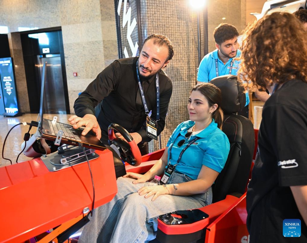 A visitor learns about tech products during Türkiye Innovation Week 2024 in Istanbul, Türkiye, Oct. 11, 2024. The event was held at the Halic Congress Center in Istanbul from Oct. 10 to 12. (Photo: Xinhua)