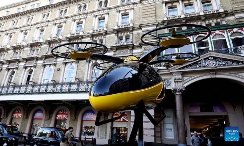 A prototype of a flying taxi, which is currently in development in the United Arab Emirates (UAE), is seen on display in the taxi rank outside Charing Cross railway station in London, Britain, Oct. 11, 2024. (Photo: Xinhua)