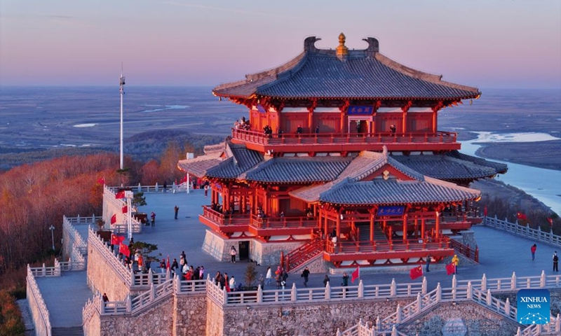 A drone photo shows tourists enjoying the sunrise scenery in Fuyuan City, northeast China's Heilongjiang Province, Oct. 12, 2024. Fuyuan City, a famous tourist attraction, has attracted over 2.1 million visitors from January to September this year. (Photo: Xinhua)