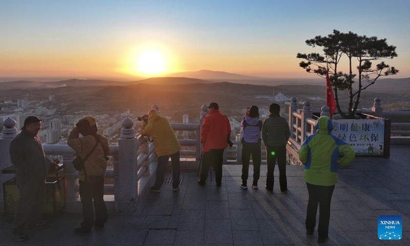 A drone photo shows tourists enjoying the sunrise scenery in Fuyuan City, northeast China's Heilongjiang Province, Oct. 12, 2024. Fuyuan City, a famous tourist attraction, has attracted over 2.1 million visitors from January to September this year. (Photo: Xinhua)