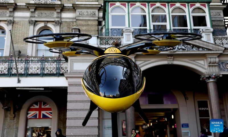 A prototype of a flying taxi, which is currently in development in the United Arab Emirates (UAE), is seen on display in the taxi rank outside Charing Cross railway station in London, Britain, Oct. 11, 2024. (Photo: Xinhua)