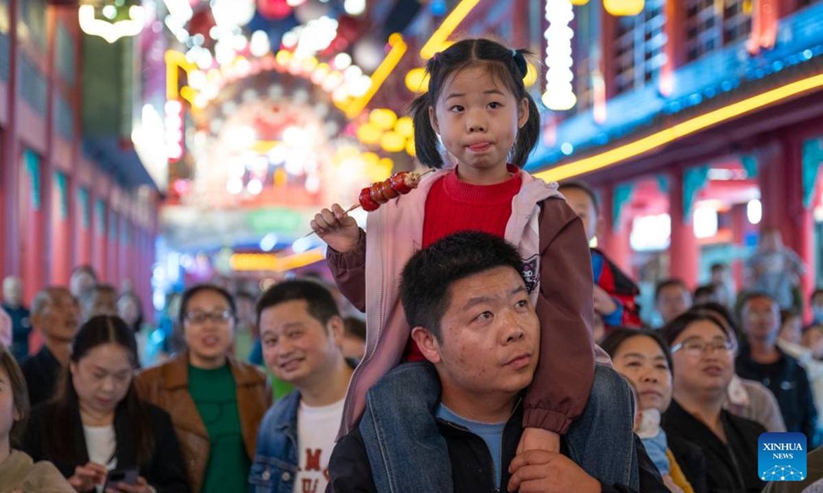 People watch a performance at a tourist attraction in Zhuxi County of Shiyan City, central China's Hubei Province, Oct. 12, 2024. (Photo: Xinhua)