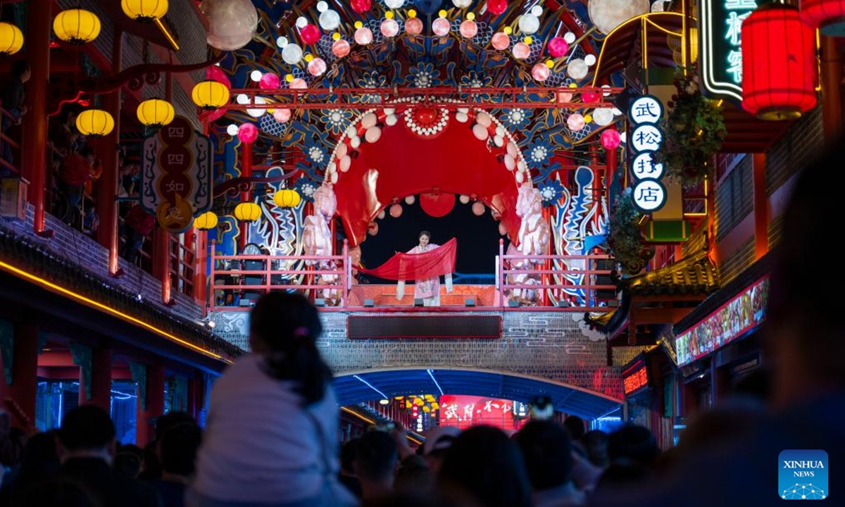 People watch a performance at a tourist attraction in Zhuxi County of Shiyan City, central China's Hubei Province, Oct. 12, 2024. (Photo: Xinhua)