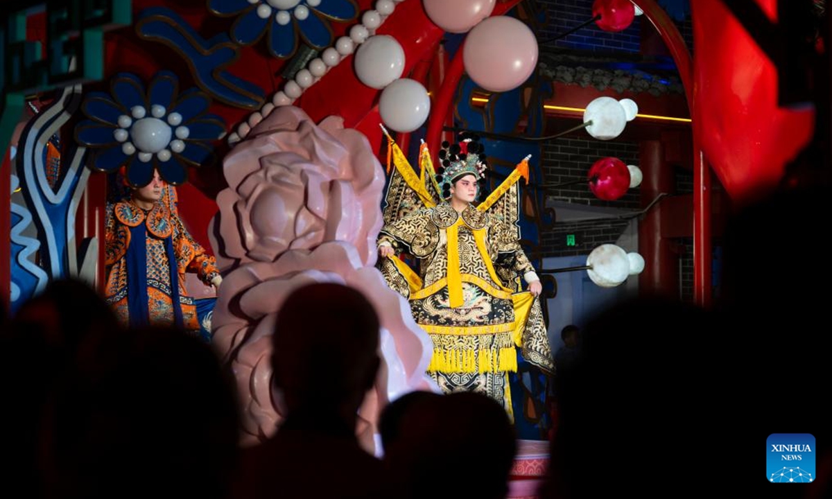 People watch a performance at a tourist attraction in Zhuxi County of Shiyan City, central China's Hubei Province, Oct. 12, 2024. (Photo: Xinhua)