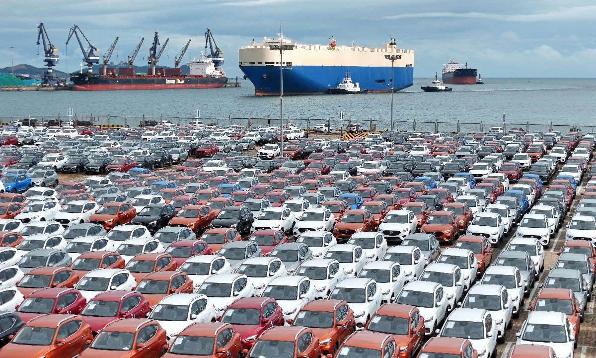 China-made automobiles are waiting for export at the port of Yantai in East China's Shandong Province on October 14, 2024. China's total trade reached 32.33 trillion yuan ($4.57 trillion) in the first three quarters of 2024. Exports of the 