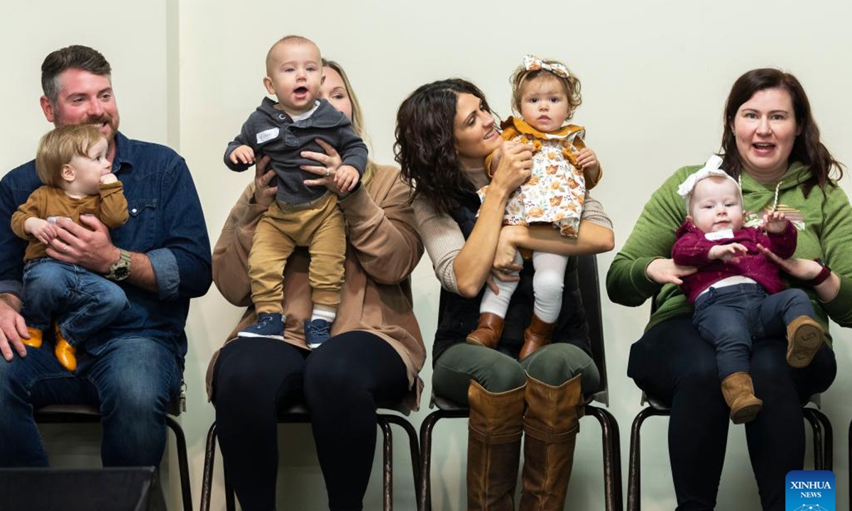 Parents show off their babies during a baby show held at the Burford Fall Fair in Burford, Ontario, Canada, on Oct. 13, 2024.   (Photo: Xinhua)