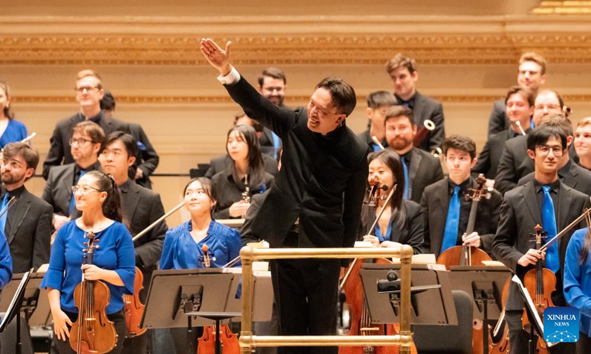 Conductor Cai Jindong salutes Chinese musicians at the opening concert of the 7th China Now Music Festival at Carnegie Hall in New York, the United States, Oct. 12, 2024. (Photo: Xinhua)